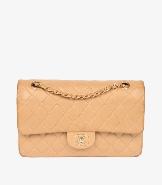 A pre-loved Chanel Beige Quilted Lambskin Leather Vintage Medium Classic Double Flap Bag