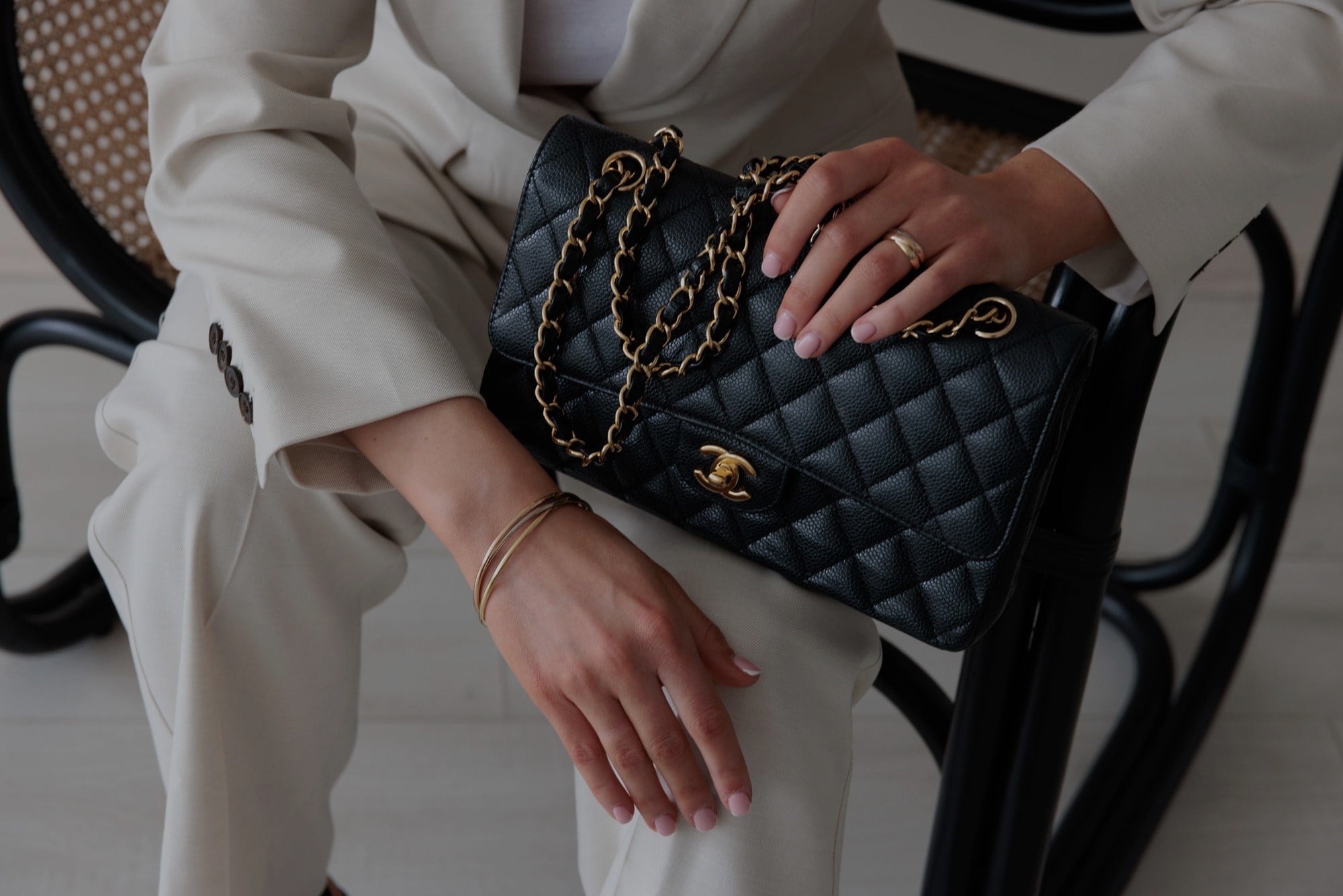 A pre-loved Chanel bag held by its owner