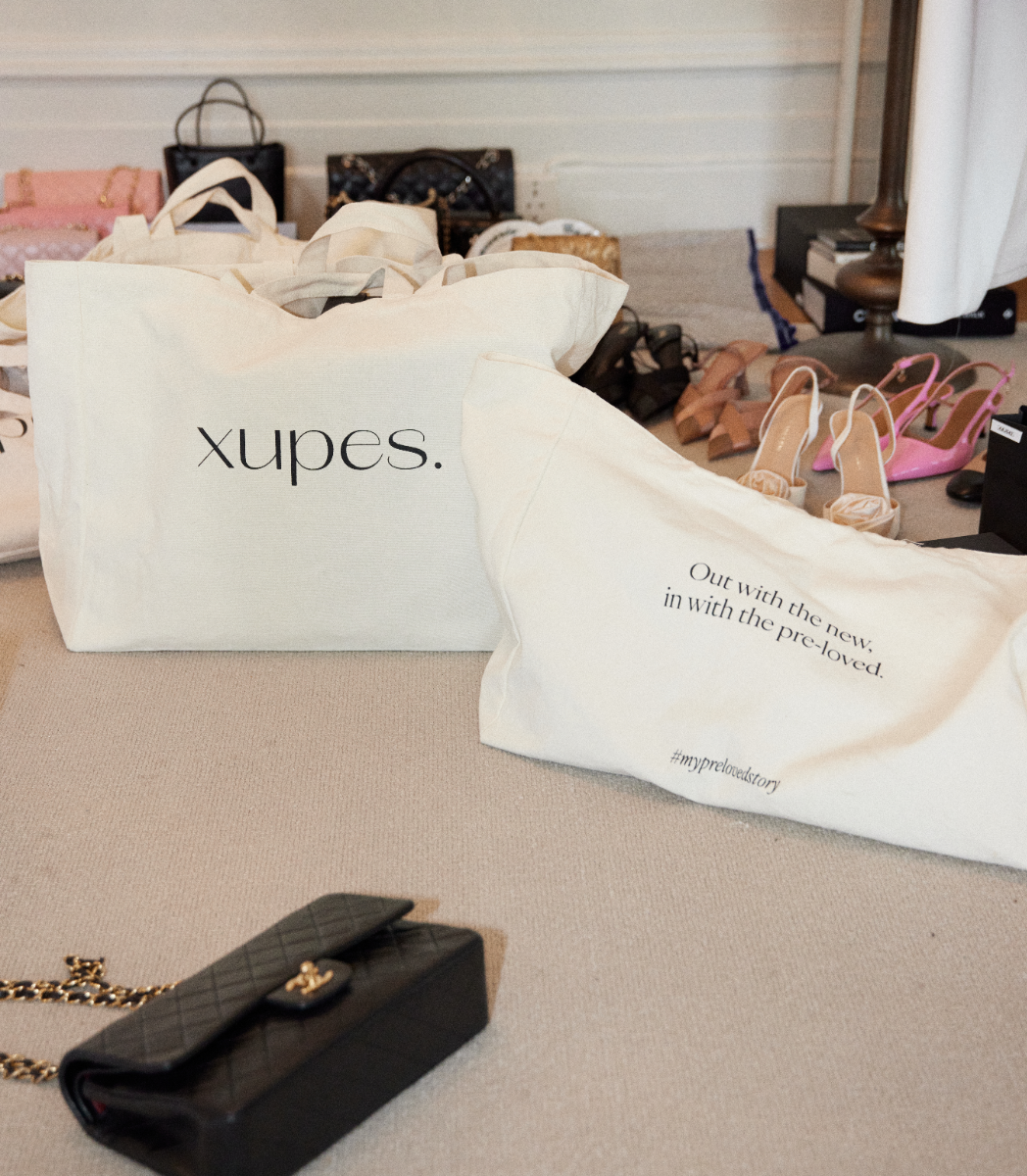 Xupes reusable tote bag amoungst shoes and clothing with a vintage pre-loved Chanel Black Classic Double Flap Bag with Gold Hardware.