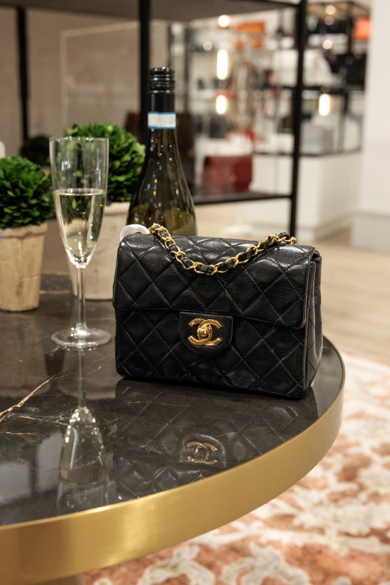 Pre-loved Chanel Black Quilted Lambskin Mini Flap Bag in Sandersons store from Xupes